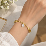 Gold Wave Teardrop Solitaire Open Cuff
