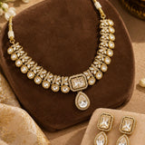 Gold Uncut Kundan & Pear-Drop Necklace Set with Maang Tikka